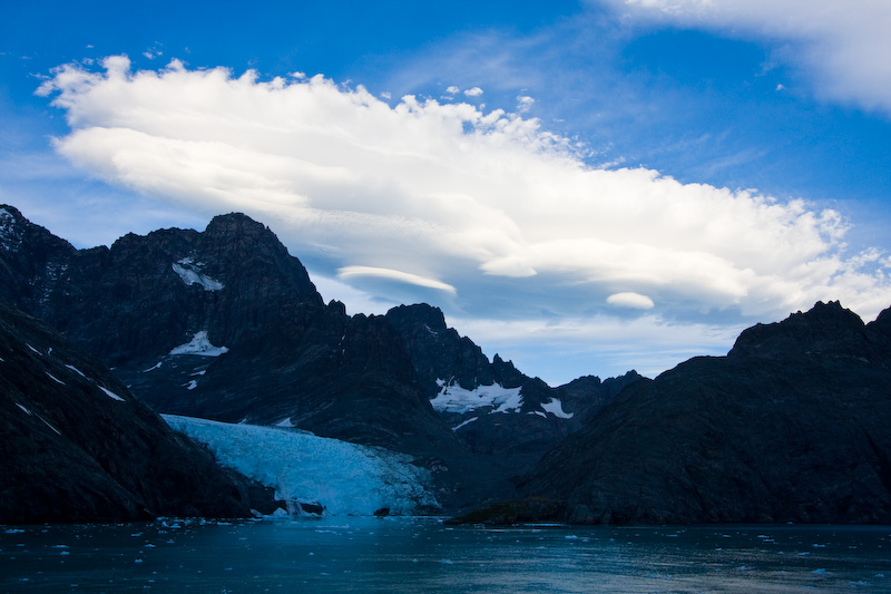 Lenticular Clouds Above Peaks